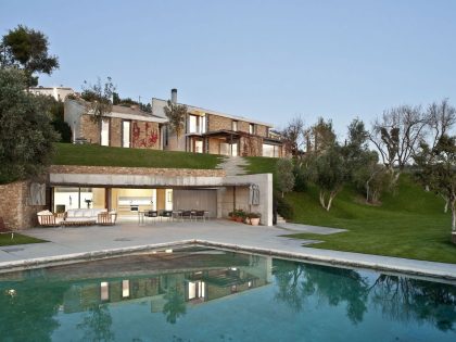 A Modern House with Stone on the Outside and Exposed Concrete on the Inside in El Ampurdán by b720 Fermín Vázquez Arquitectos (16)