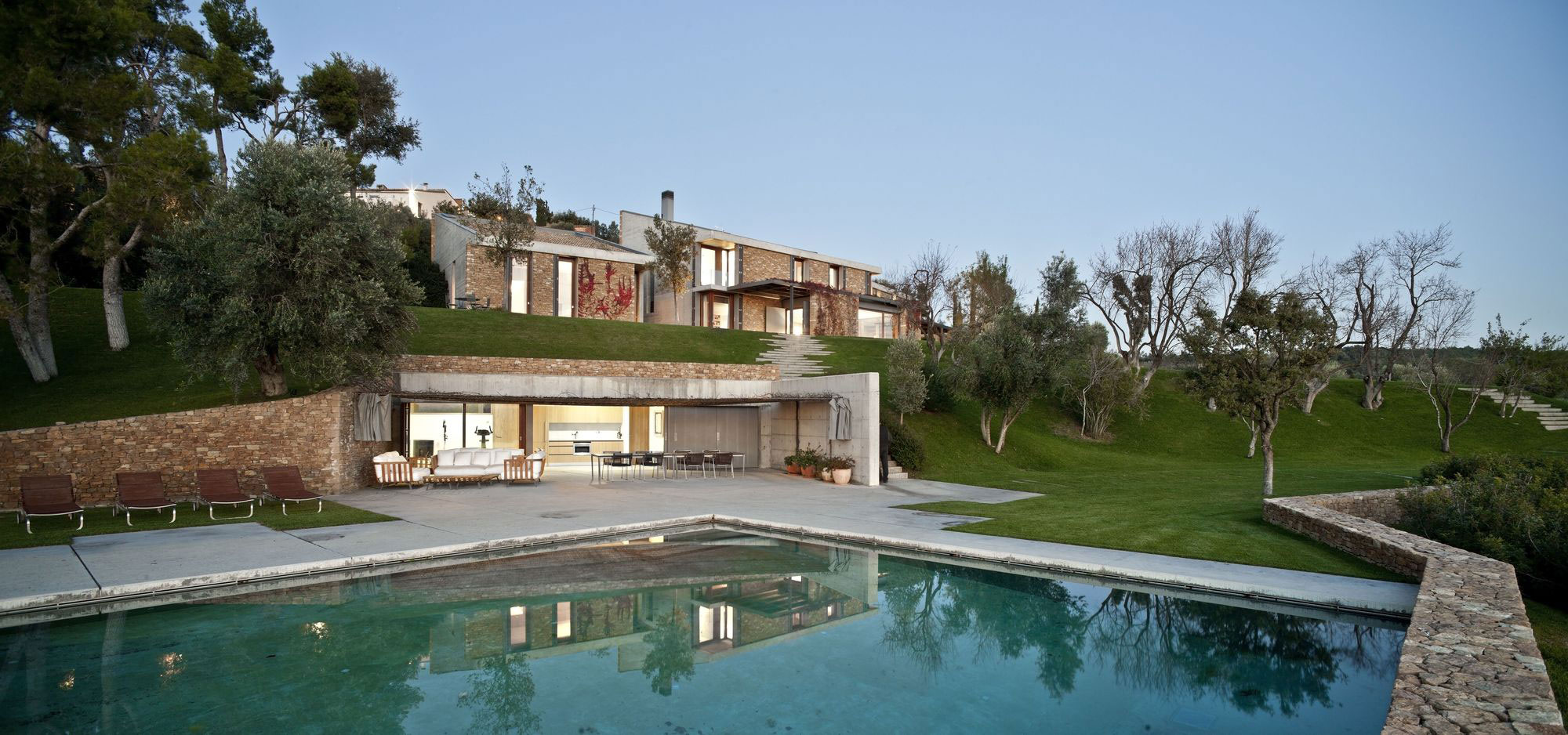 A Modern House with Stone on the Outside and Exposed Concrete on the Inside in El Ampurdán by b720 Fermín Vázquez Arquitectos (16)