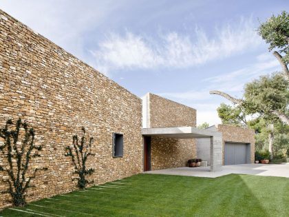 A Modern House with Stone on the Outside and Exposed Concrete on the Inside in El Ampurdán by b720 Fermín Vázquez Arquitectos (17)