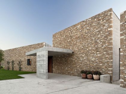 A Modern House with Stone on the Outside and Exposed Concrete on the Inside in El Ampurdán by b720 Fermín Vázquez Arquitectos (18)