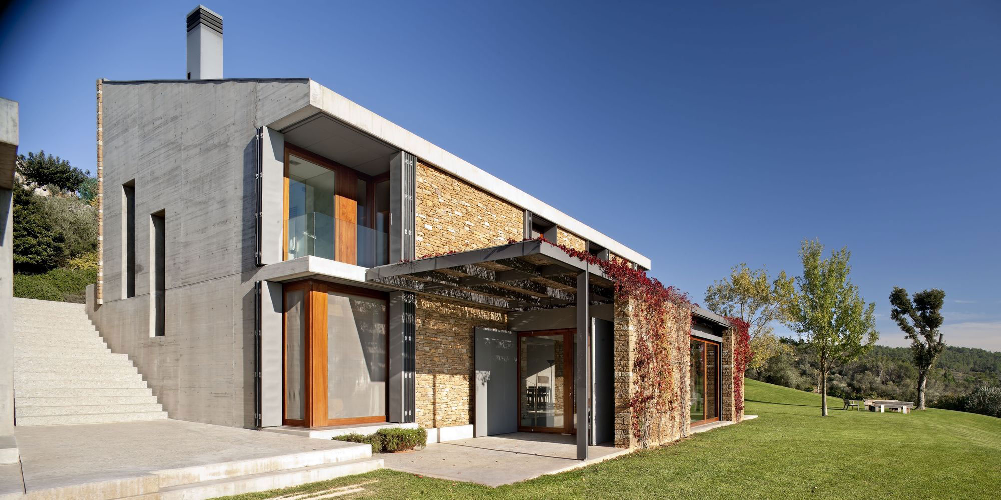 A Modern House with Stone on the Outside and Exposed Concrete on the Inside in El Ampurdán by b720 Fermín Vázquez Arquitectos (3)