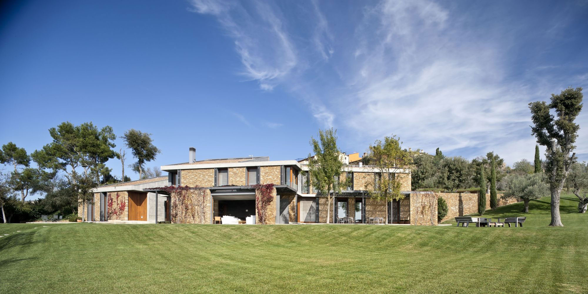 A Modern House with Stone on the Outside and Exposed Concrete on the Inside in El Ampurdán by b720 Fermín Vázquez Arquitectos (4)