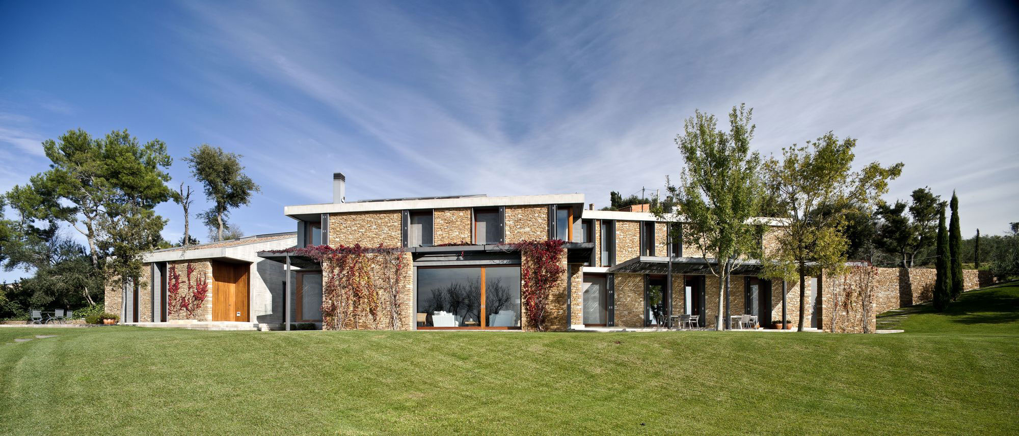A Modern House with Stone on the Outside and Exposed Concrete on the Inside in El Ampurdán by b720 Fermín Vázquez Arquitectos (5)