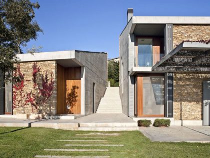 A Modern House with Stone on the Outside and Exposed Concrete on the Inside in El Ampurdán by b720 Fermín Vázquez Arquitectos (6)