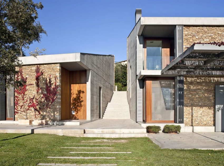 A Modern House with Stone on the Outside and Exposed Concrete on the Inside in El Ampurdán by b720 Fermín Vázquez Arquitectos (6)