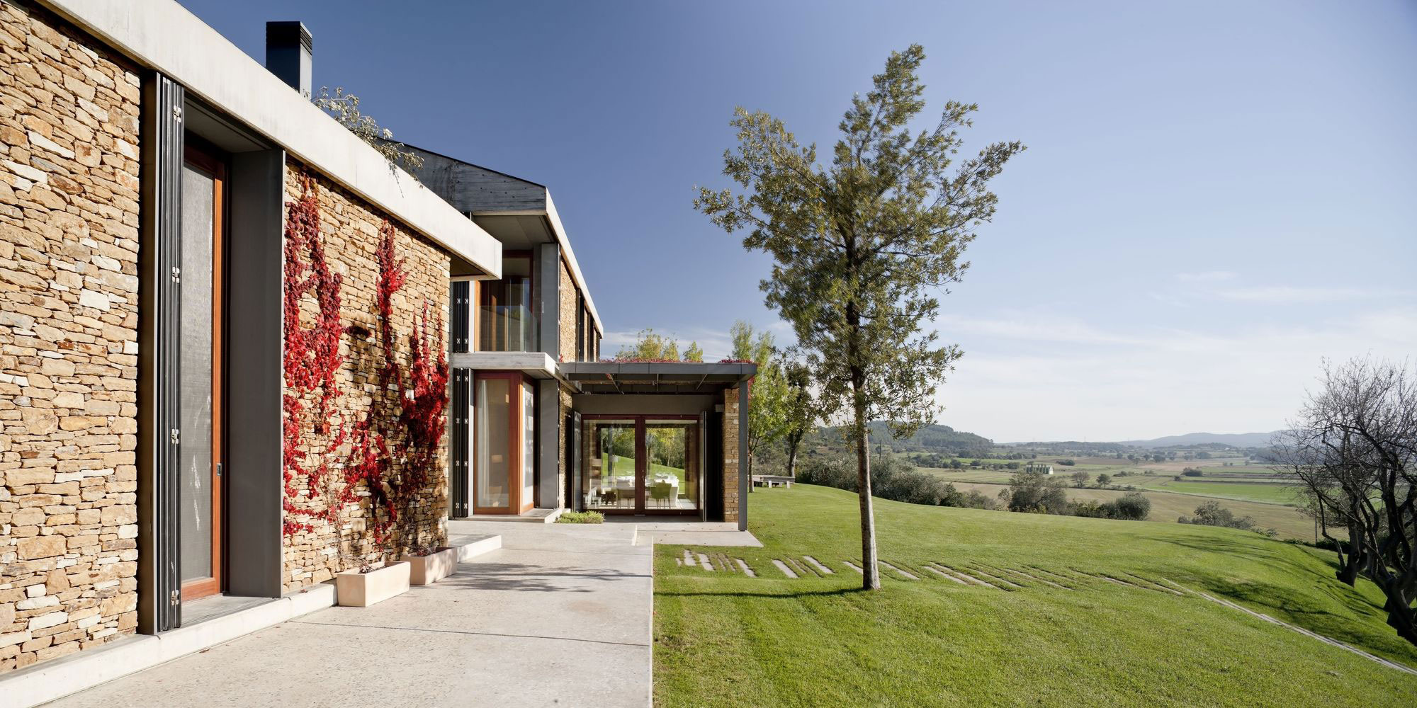 A Modern House with Stone on the Outside and Exposed Concrete on the Inside in El Ampurdán by b720 Fermín Vázquez Arquitectos (7)