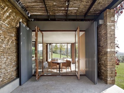 A Modern House with Stone on the Outside and Exposed Concrete on the Inside in El Ampurdán by b720 Fermín Vázquez Arquitectos (8)