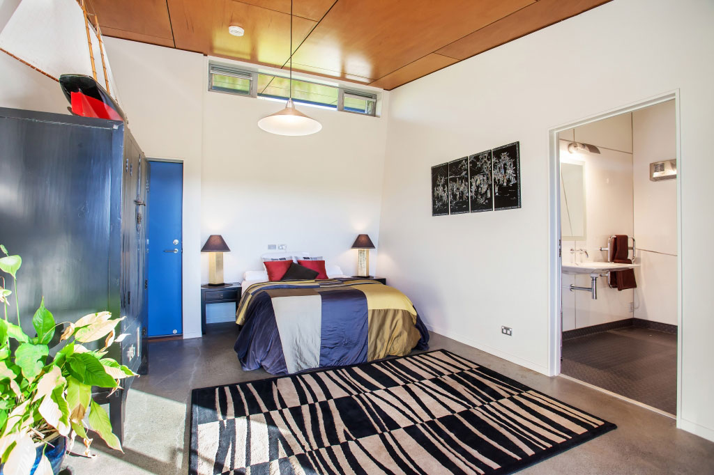 A Spacious Waterfront Home with Bold and Vibrant Interiors in Kerikeri by Richard Naish (25)