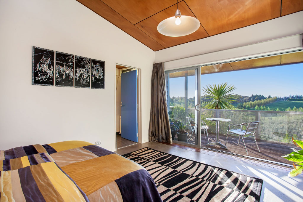 A Spacious Waterfront Home with Bold and Vibrant Interiors in Kerikeri by Richard Naish (26)