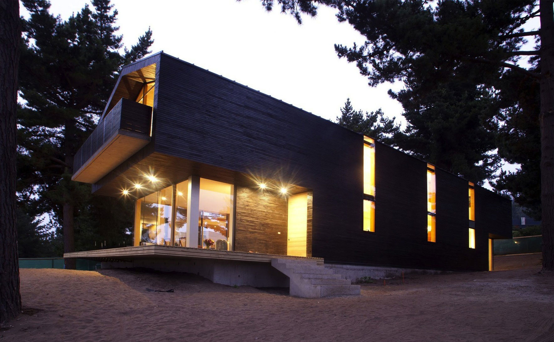 A Spacious and Warm Modern Home Embraced by a Forest of Pines in Zapallar by Raimundo Anguita (9)