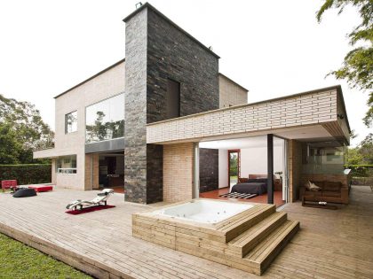 A Striking Contemporary Home Separated by a Stunning Black Stone Walls in Llano Grande, Colombia by David Ramirez (1)