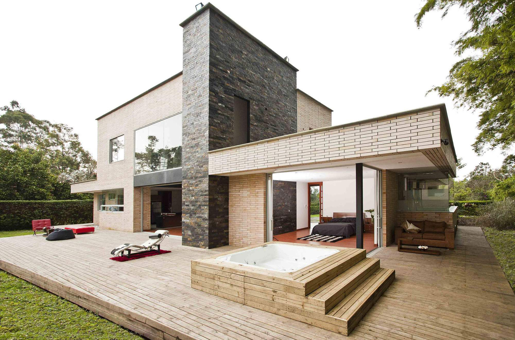 A Striking Contemporary Home Separated by a Stunning Black Stone Walls in Llano Grande, Colombia by David Ramirez (1)
