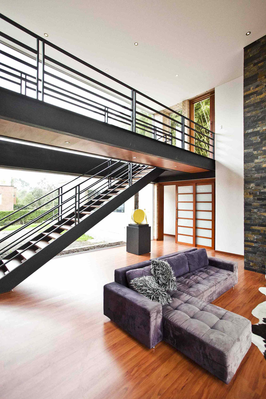 A Striking Contemporary Home Separated by a Stunning Black Stone Walls in Llano Grande, Colombia by David Ramirez (12)
