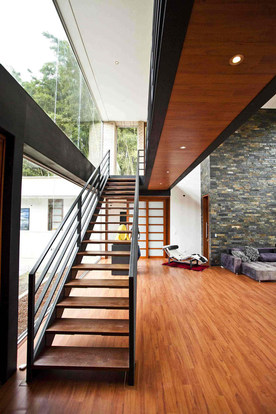 A Striking Contemporary Home Separated by a Stunning Black Stone Walls in Llano Grande, Colombia by David Ramirez (13)