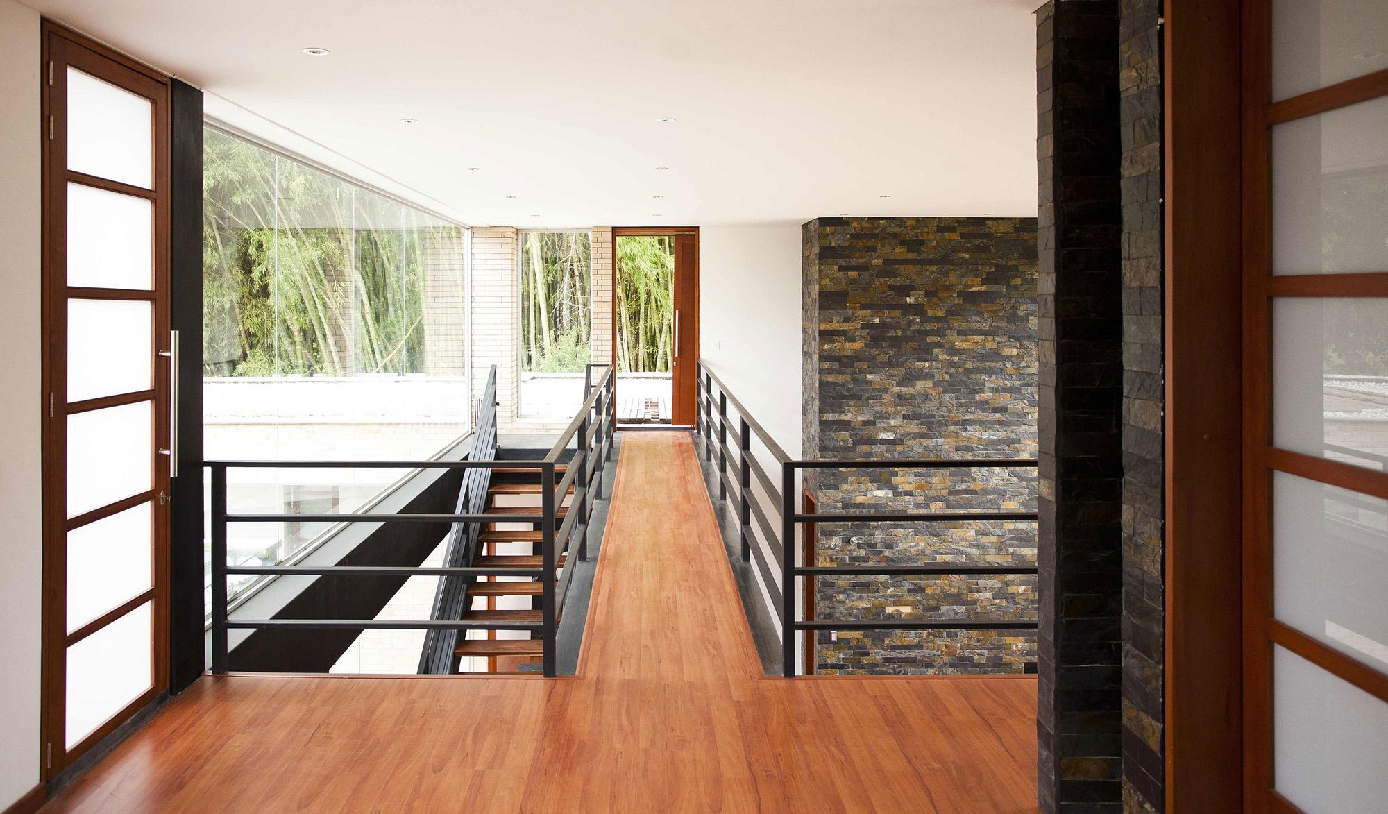 A Striking Contemporary Home Separated by a Stunning Black Stone Walls in Llano Grande, Colombia by David Ramirez (17)