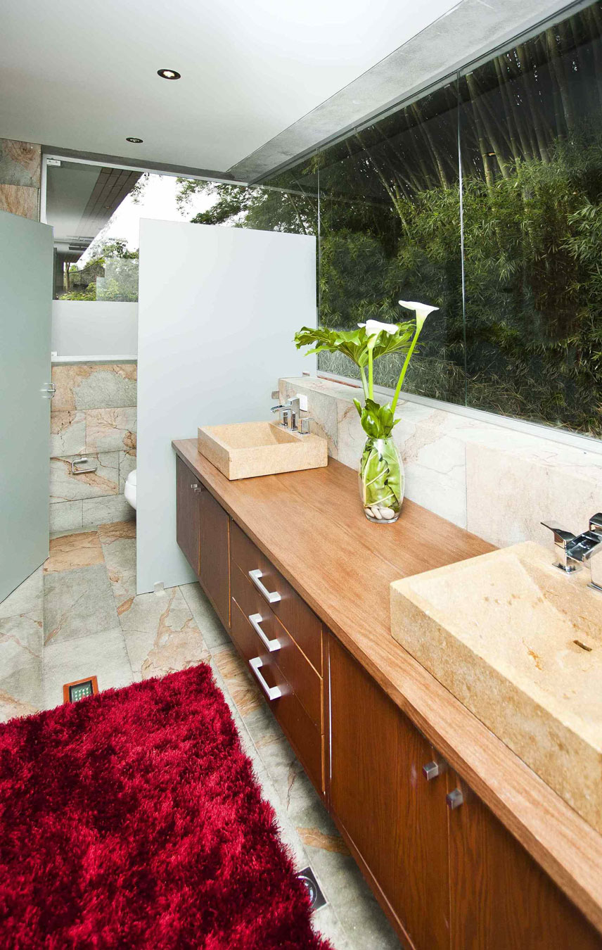 A Striking Contemporary Home Separated by a Stunning Black Stone Walls in Llano Grande, Colombia by David Ramirez (18)