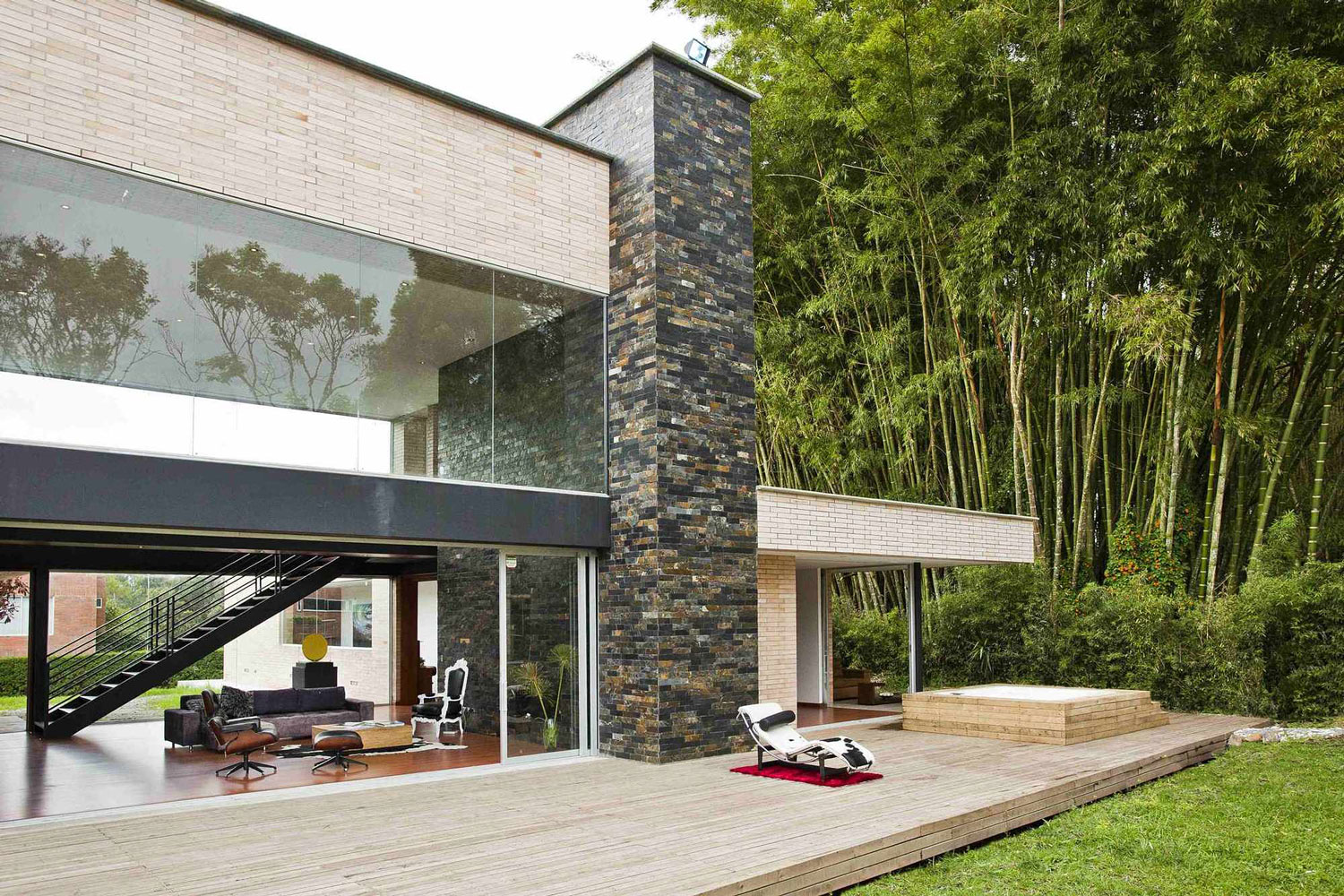 A Striking Contemporary Home Separated by a Stunning Black Stone Walls in Llano Grande, Colombia by David Ramirez (4)