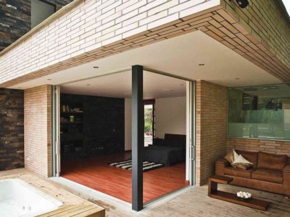 A Striking Contemporary Home Separated by a Stunning Black Stone Walls in Llano Grande, Colombia by David Ramirez (7)