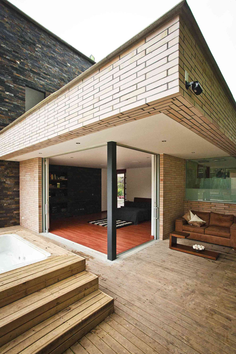 A Striking Contemporary Home Separated by a Stunning Black Stone Walls in Llano Grande, Colombia by David Ramirez (7)