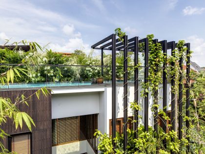 A Stunning House Surrounded by Lush Greenery and Courtyard Gardens in Singapore