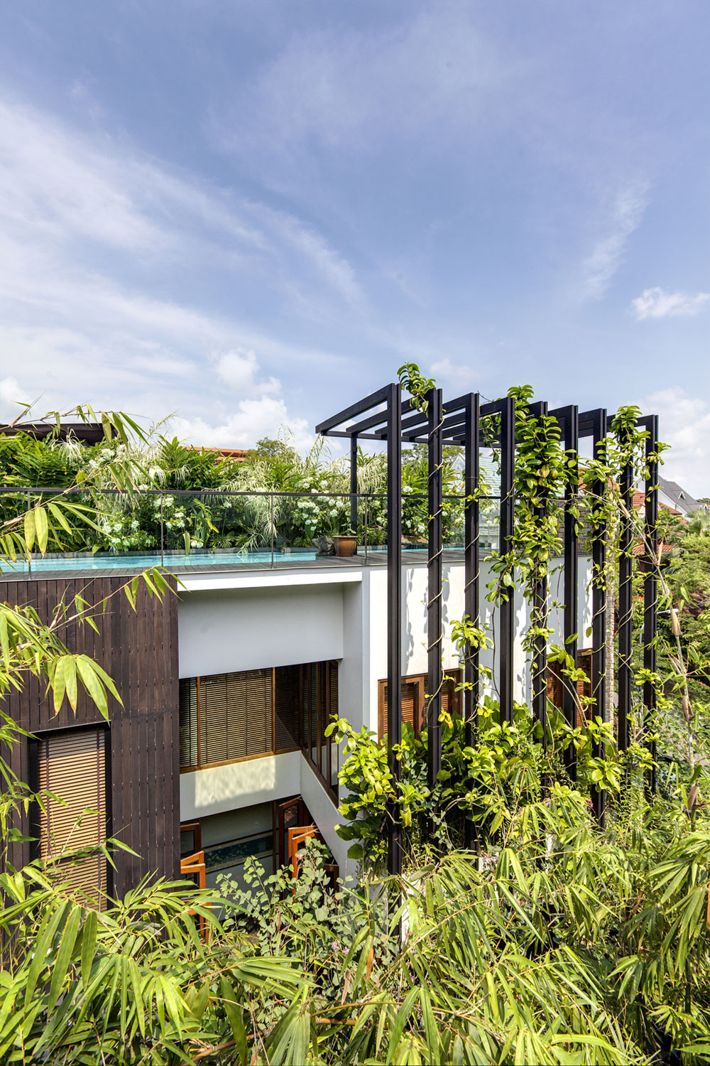 A Stunning House Surrounded by Lush Greenery and Courtyard Gardens in Singapore by Aamer Architects (1)