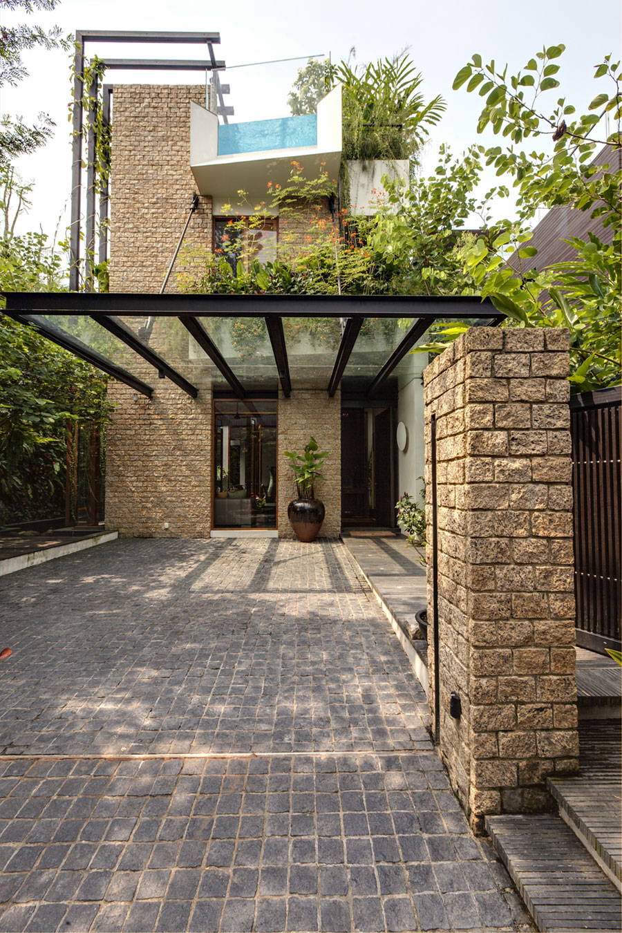 A Stunning House Surrounded by Lush Greenery and Courtyard Gardens in Singapore by Aamer Architects (10)