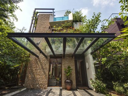 A Stunning House Surrounded by Lush Greenery and Courtyard Gardens in Singapore by Aamer Architects (11)