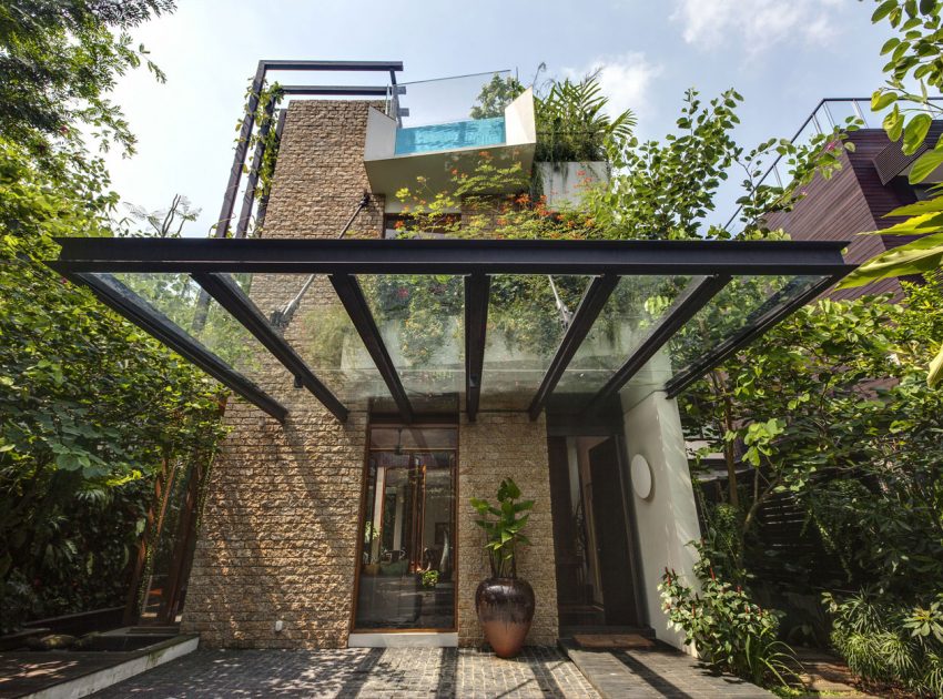 A Stunning House Surrounded by Lush Greenery and Courtyard Gardens in Singapore by Aamer Architects (11)