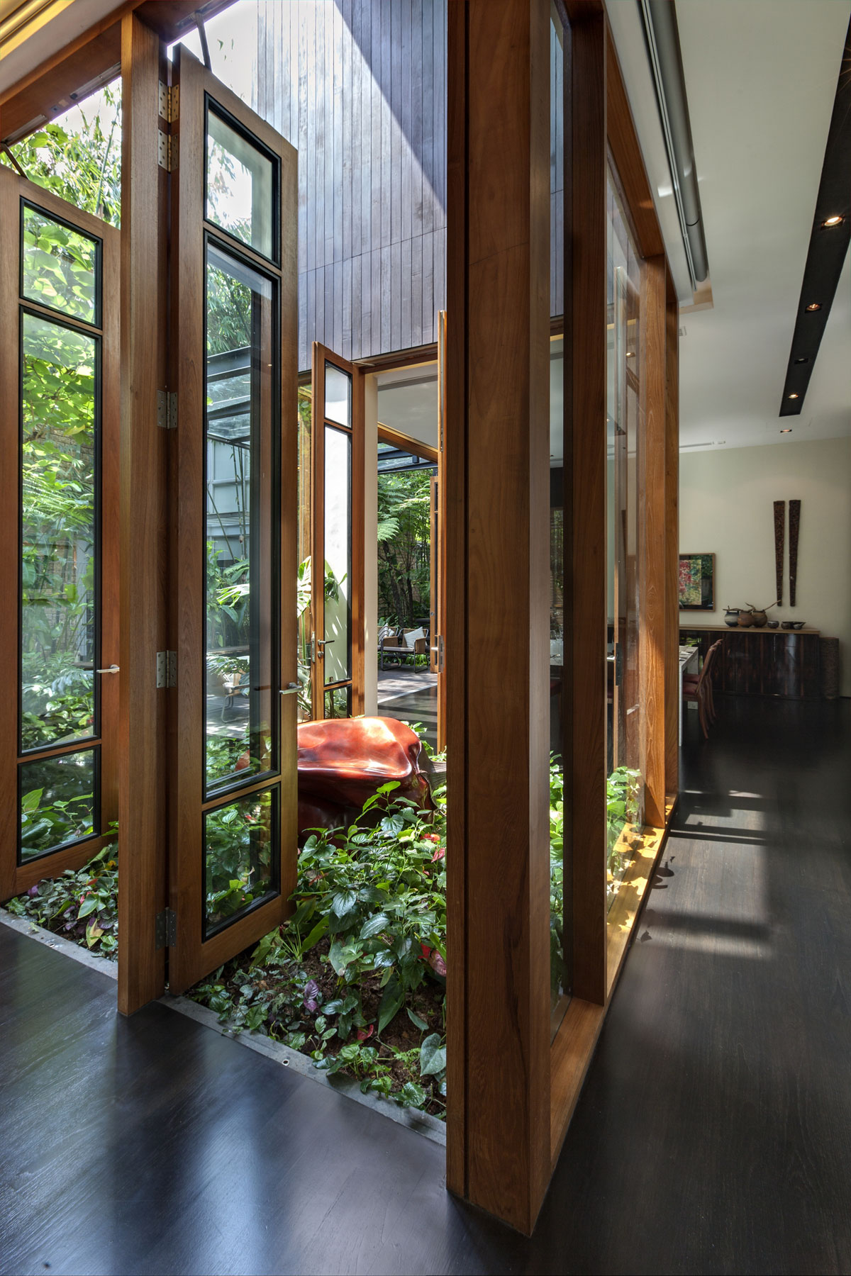A Stunning House Surrounded by Lush Greenery and Courtyard Gardens in Singapore by Aamer Architects (18)