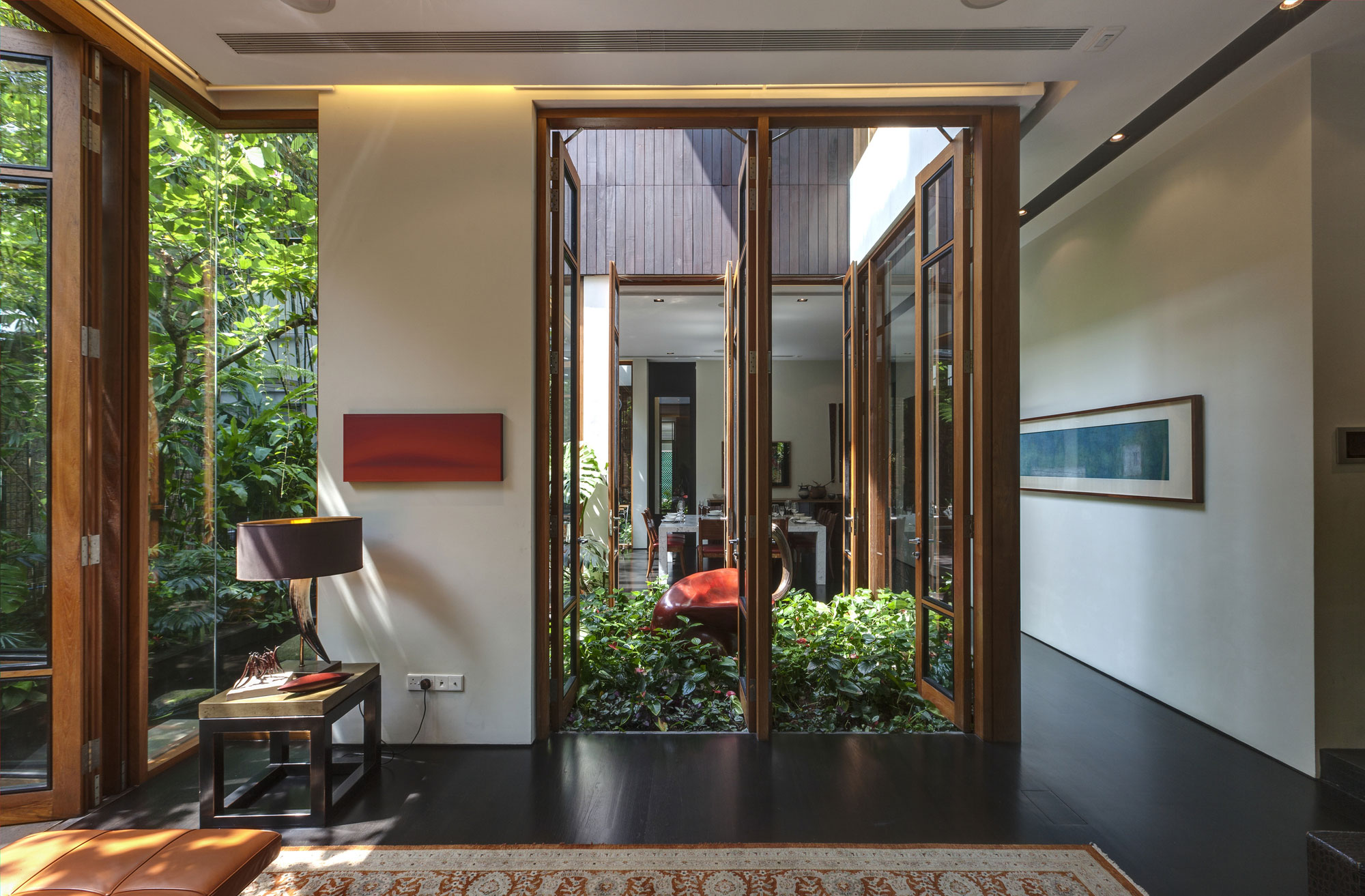 A Stunning House Surrounded by Lush Greenery and Courtyard Gardens in Singapore by Aamer Architects (19)