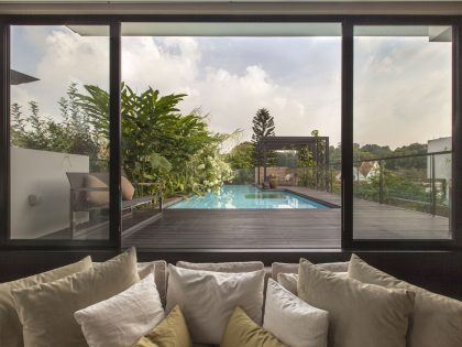 A Stunning House Surrounded by Lush Greenery and Courtyard Gardens in Singapore by Aamer Architects (23)