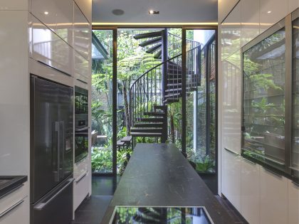 A Stunning House Surrounded by Lush Greenery and Courtyard Gardens in Singapore by Aamer Architects (24)