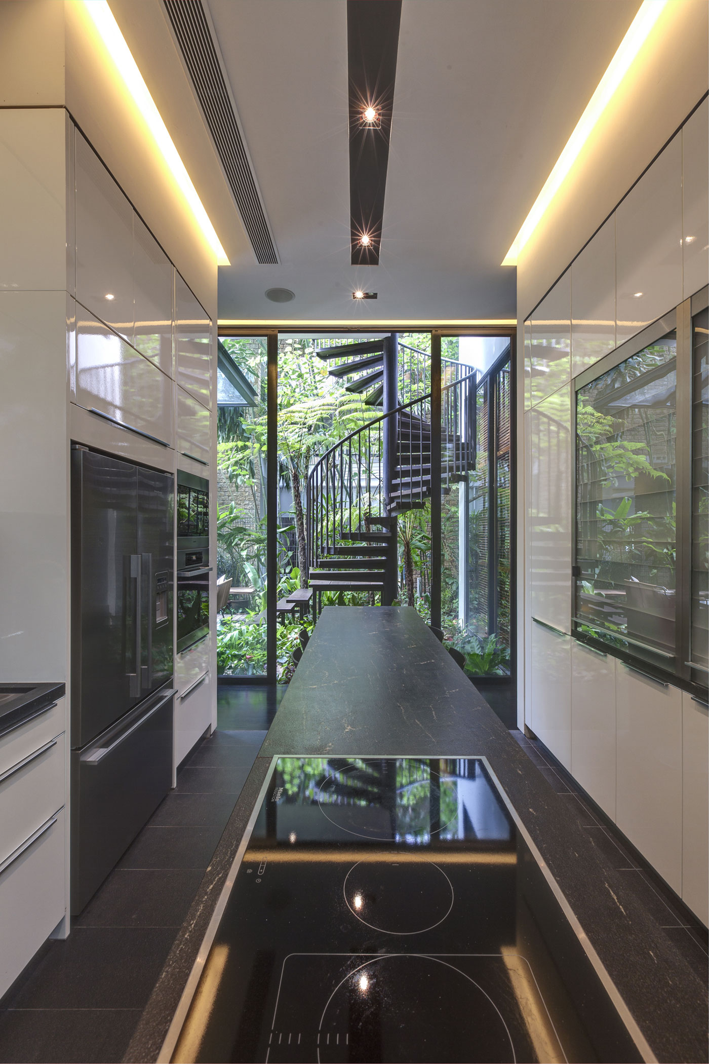 A Stunning House Surrounded by Lush Greenery and Courtyard Gardens in Singapore by Aamer Architects (24)