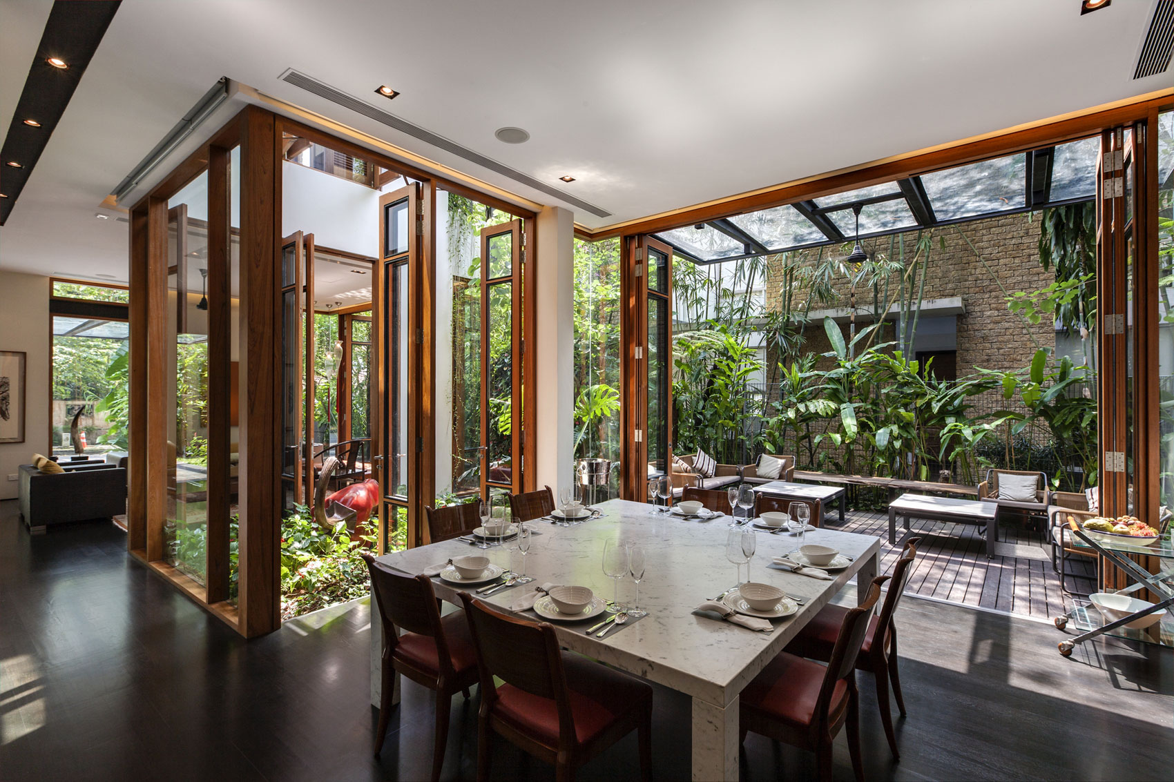 A Stunning House Surrounded by Lush Greenery and Courtyard Gardens in Singapore by Aamer Architects (26)