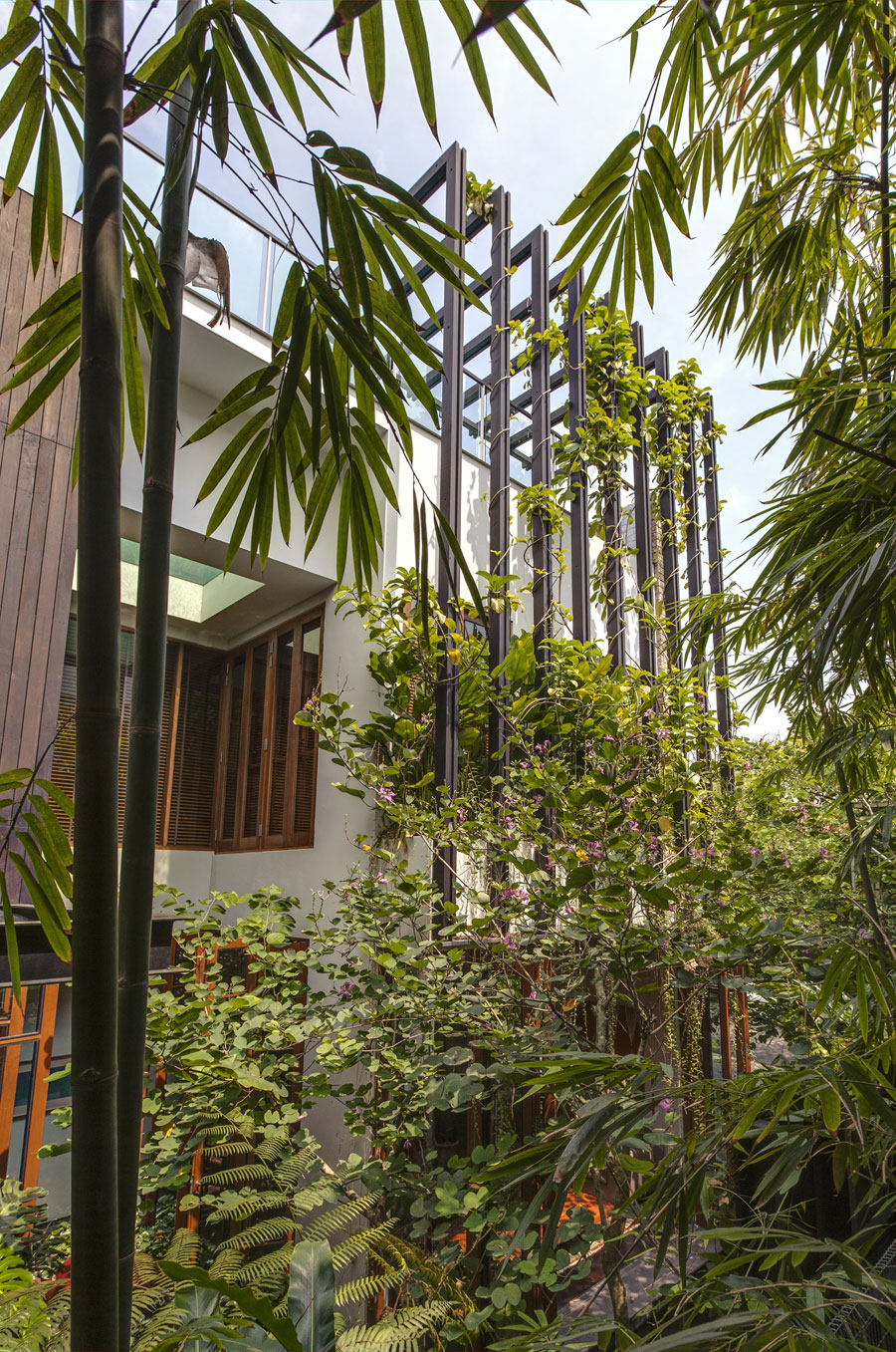 A Stunning House Surrounded by Lush Greenery and Courtyard Gardens in Singapore by Aamer Architects (3)