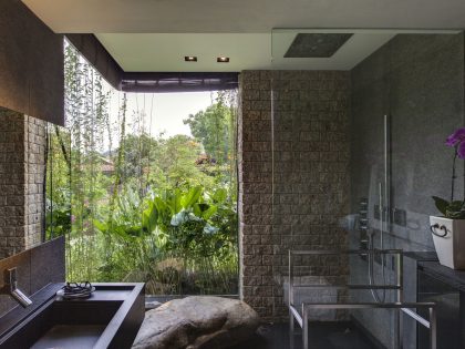 A Stunning House Surrounded by Lush Greenery and Courtyard Gardens in Singapore by Aamer Architects (30)