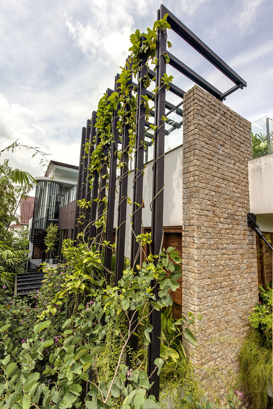 A Stunning House Surrounded by Lush Greenery and Courtyard Gardens in Singapore by Aamer Architects (4)