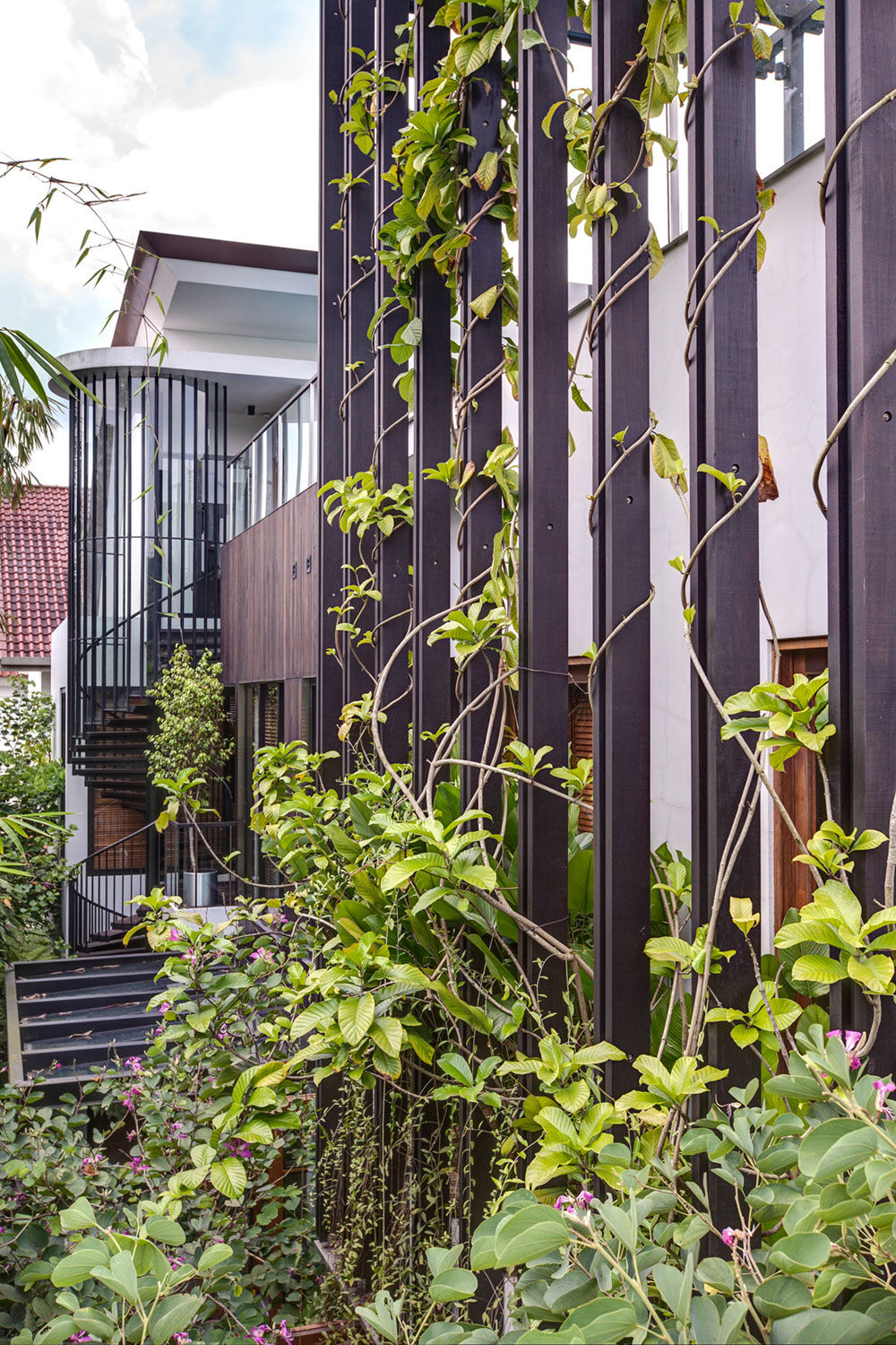 A Stunning House Surrounded by Lush Greenery and Courtyard Gardens in Singapore by Aamer Architects (5)