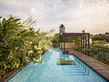 A Stunning House Surrounded by Lush Greenery and Courtyard Gardens in Singapore by Aamer Architects (6)