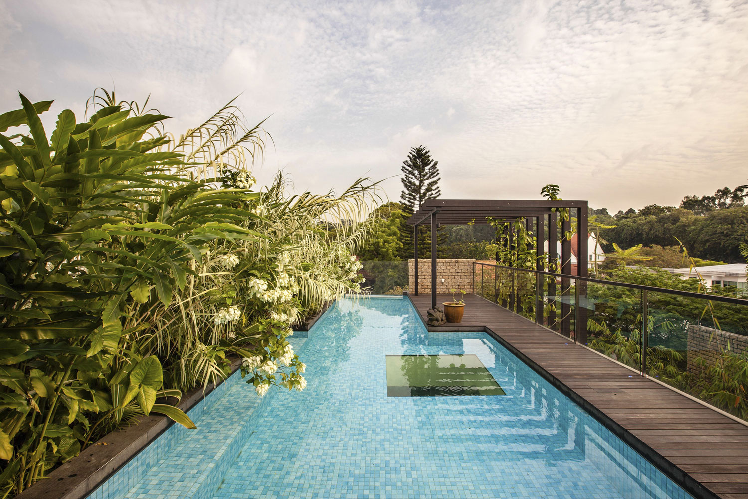 A Stunning House Surrounded by Lush Greenery and Courtyard Gardens in Singapore by Aamer Architects (6)