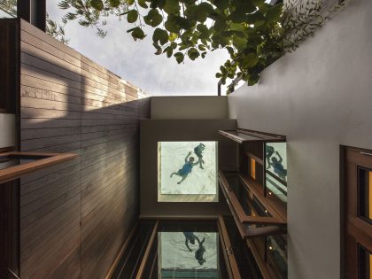 A Stunning House Surrounded by Lush Greenery and Courtyard Gardens in Singapore by Aamer Architects (8)
