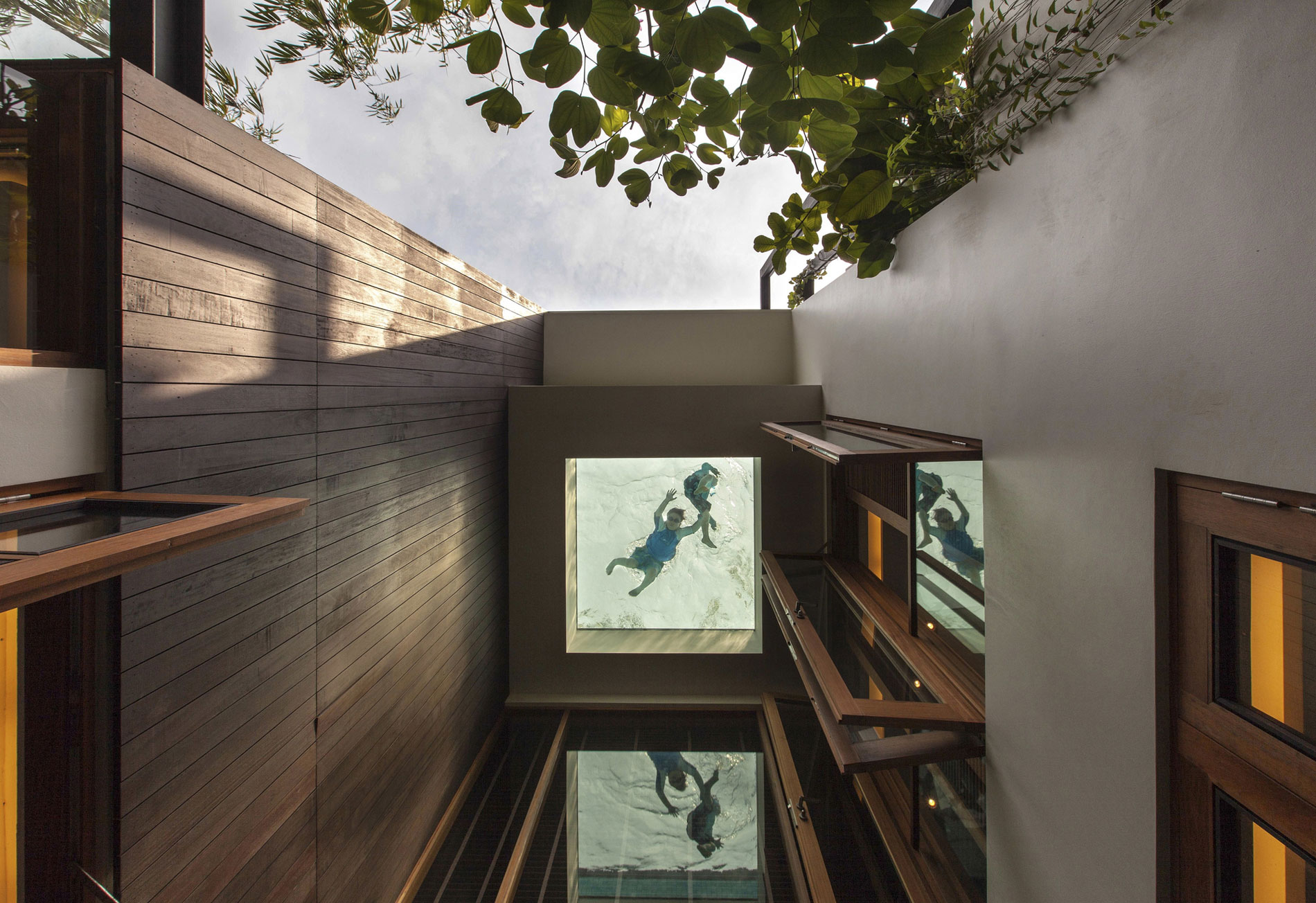 A Stunning House Surrounded by Lush Greenery and Courtyard Gardens in Singapore by Aamer Architects (8)
