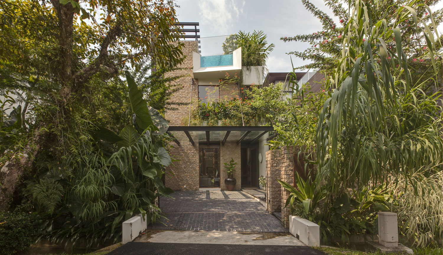 A Stunning House Surrounded by Lush Greenery and Courtyard Gardens in Singapore by Aamer Architects (9)