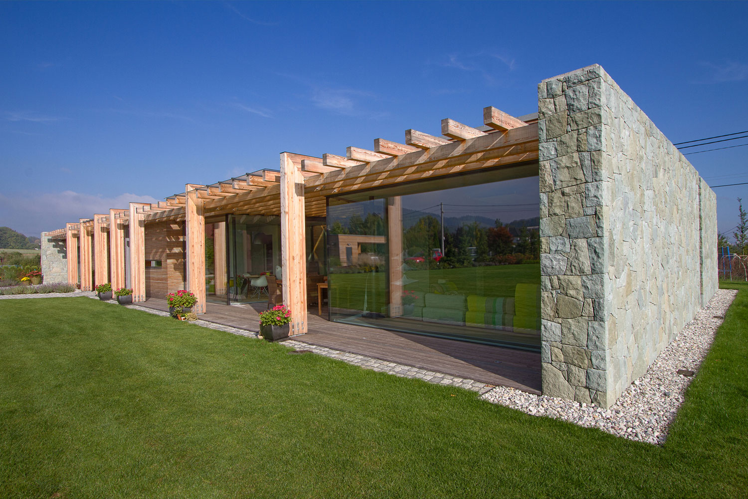 A Stylish Contemporary Home of Stone, Wood and Glass Elements in Palkovice, Czech Republic by Qarta Architektura (5)