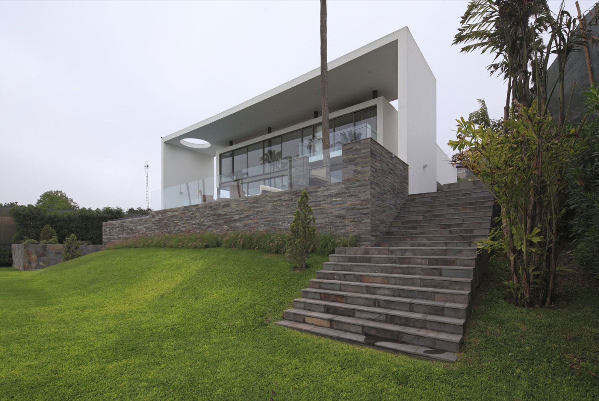 A Stylish Modern House Surrounded by Plants and Nature on the Hill in Lima by Jose Orrego (2)