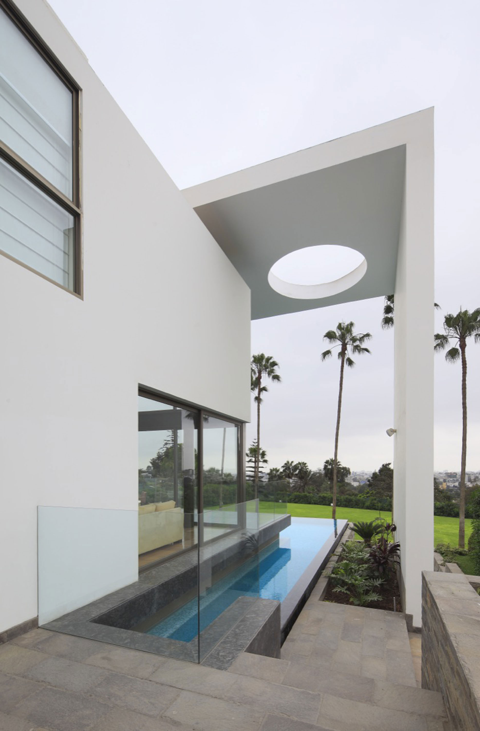 A Stylish Modern House Surrounded by Plants and Nature on the Hill in Lima by Jose Orrego (7)