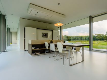 An Elegant and Captivating Modern Transparent House Behind a Grove of Trees in Bontebok, The Netherlands by Inbo (11)