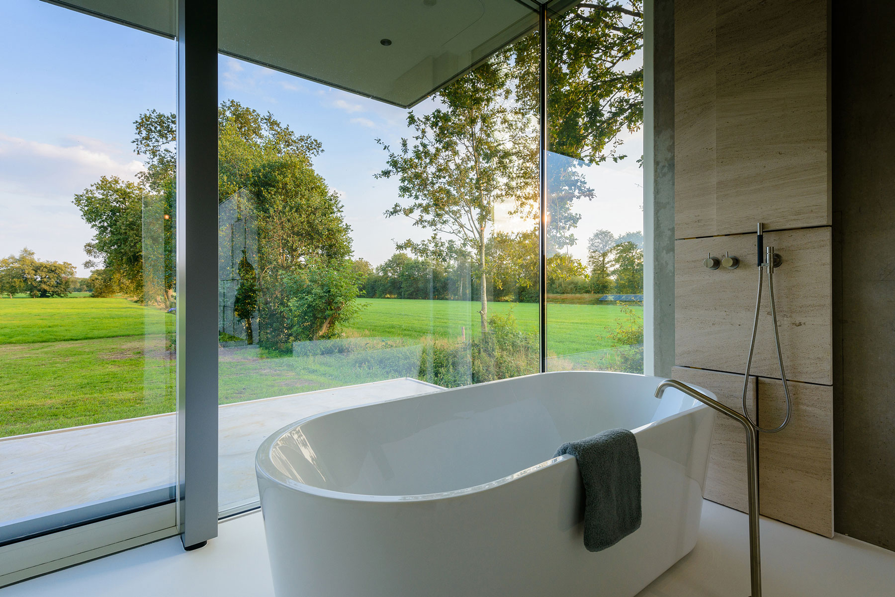 An Elegant and Captivating Modern Transparent House Behind a Grove of Trees in Bontebok, The Netherlands by Inbo (12)
