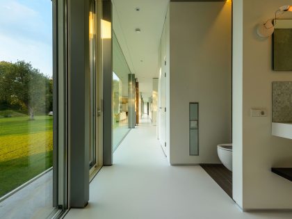 An Elegant and Captivating Modern Transparent House Behind a Grove of Trees in Bontebok, The Netherlands by Inbo (13)