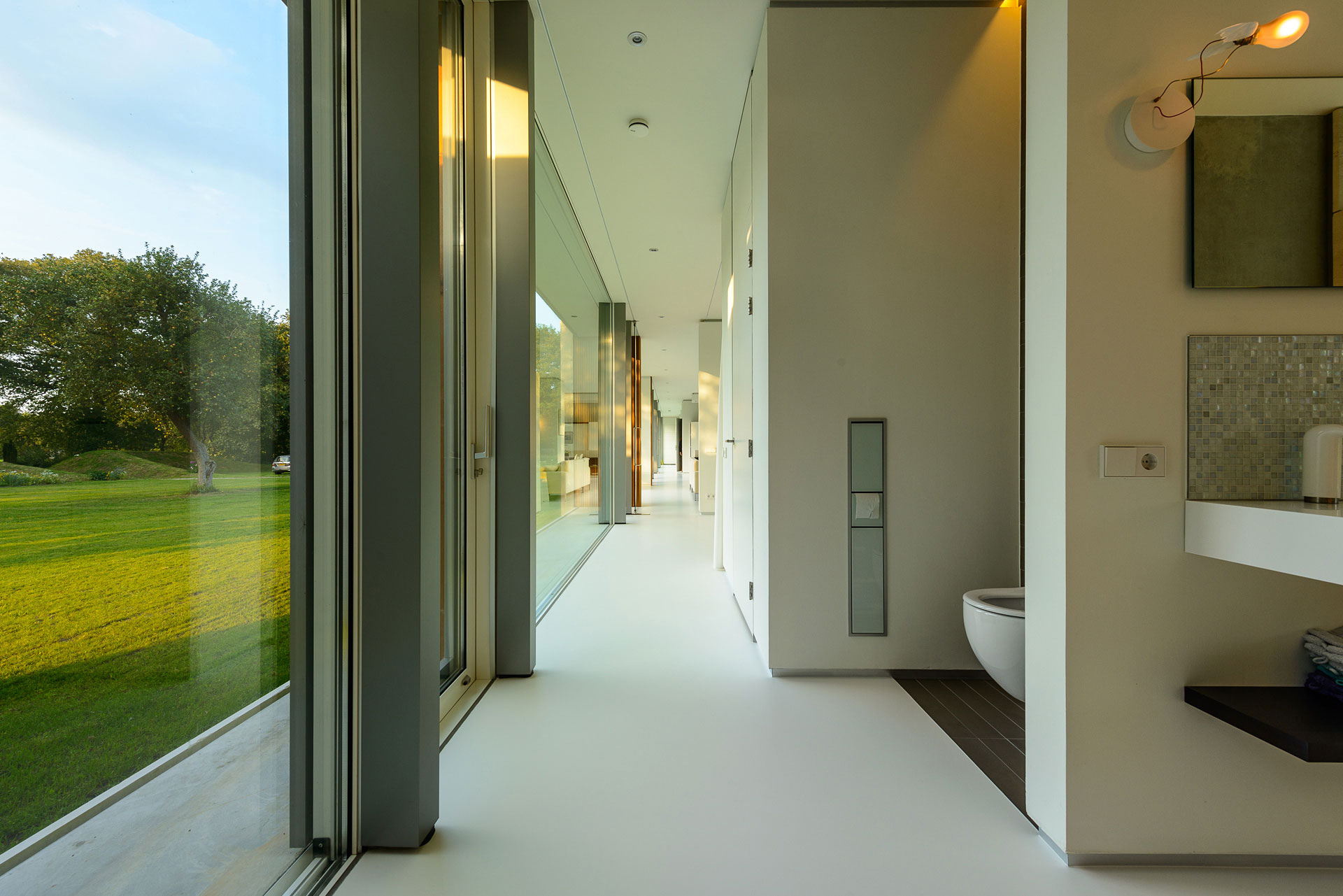 An Elegant and Captivating Modern Transparent House Behind a Grove of Trees in Bontebok, The Netherlands by Inbo (13)